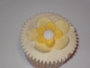 Vanilla Cupcake with white butter cream with a yellow flower