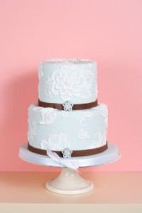 Two-tiered Cake Against Pink Background